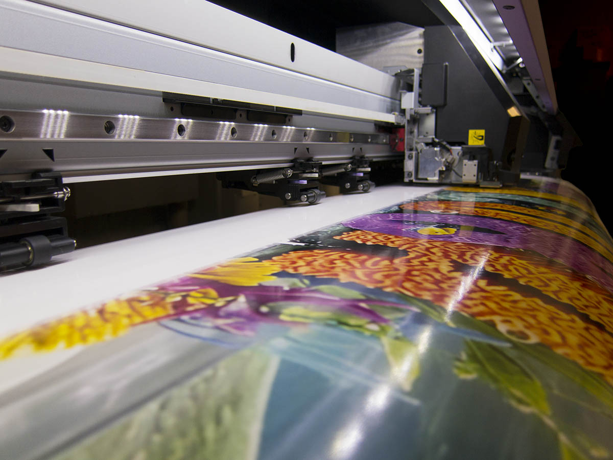 Vinyl decals, stickers, labels, and sign layouts on a sign production table